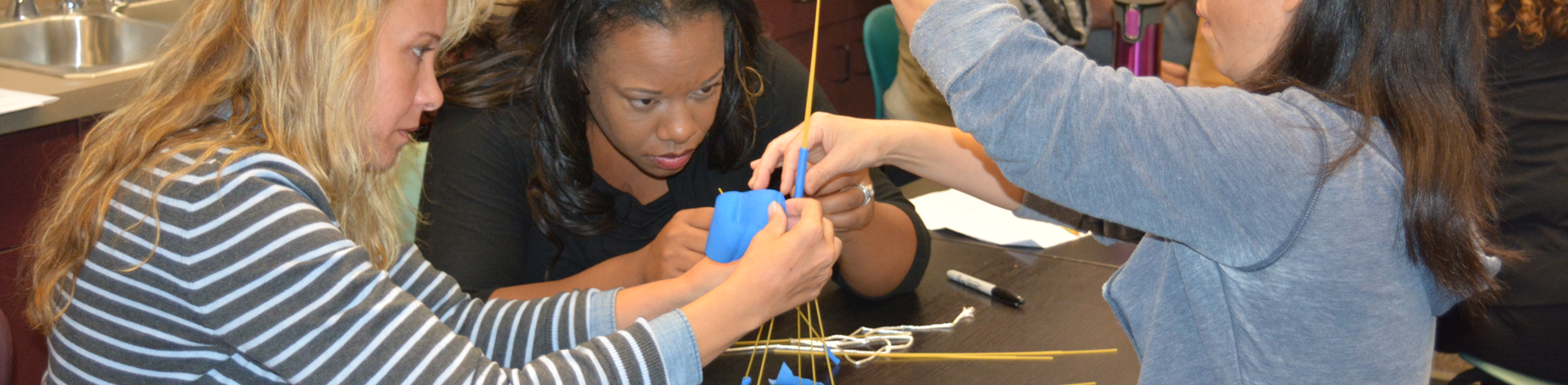 Parents work together on a project during an NFB STEM program for parents and children